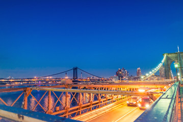 Fototapeta na wymiar Brooklyn Bridge and Manhattan with lights and reflections. New Y