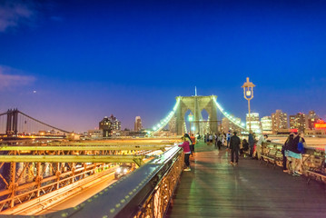 Fototapeta na wymiar Brooklyn Bridge and Manhattan with lights and reflections. New Y
