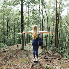 Young hipster girl in the forest hike