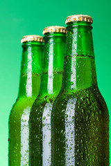 Three wet blank beer bottles