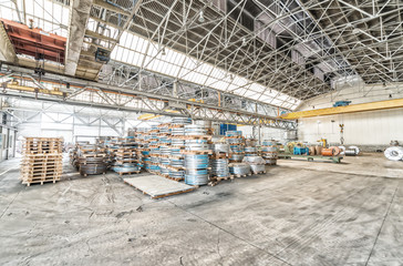 Warehouse of steel coils. Industrial environment and business co