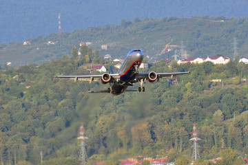 Fototapeta na wymiar Airplane take-off in airport Sochi in September 12, 2012. 