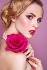 Fototapeta na wymiar Lady with pink rose.