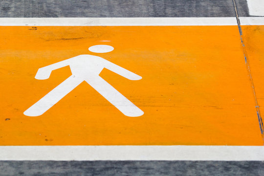 Stylized Orange Man On Crosswalk