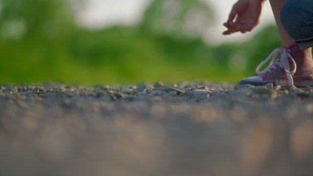 Girl is Throwing a Stone