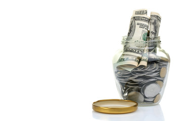 Glass bank for tips with money isolated on white