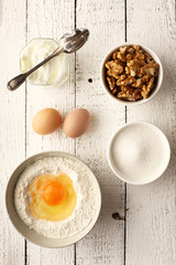 egg yoghurt walnut and sugar on a white background