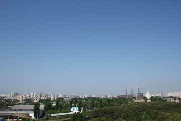 Obraz premium Chimney of a Power plant against blue sky