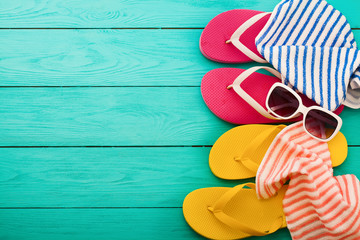 Summer accessories on blue wooden background