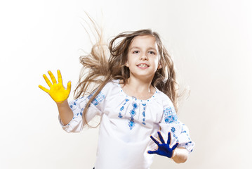 Young girl in embroidery with hands yellow and blue colors