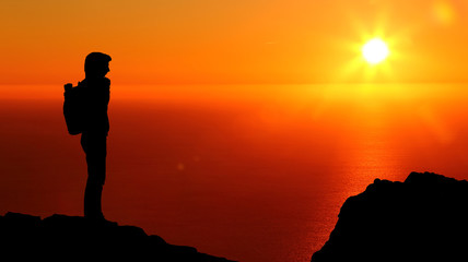 Follow your dreams, silhouette of man at sunset