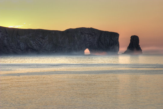 Fog Rolls In At Perce Rock In Gaspe, Quebec