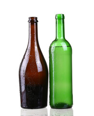 Red and white wine bottles on white background