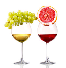 Glass of red and white wine, grape and grapefruit on a white bac