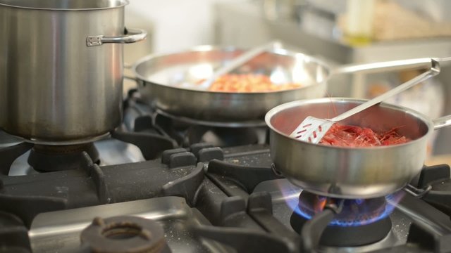 cooking king shrimp in pan 

