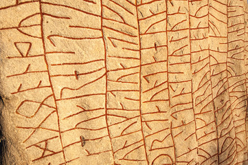 Old runic inscriptions on the Rök stone in Sweden
