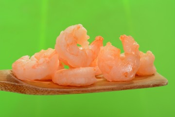 Shrimps on wooden spoon
