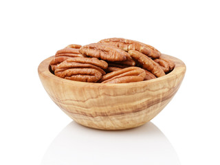 Pecan halves in a bowl isolated on a white