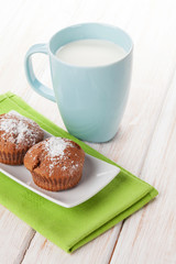 Cup of milk and cakes