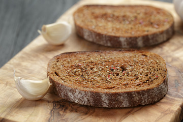 Fototapeta na wymiar rye bread grated with garlic, crostini