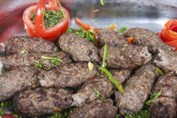 Grilled kofta meat at an oriental restaurant buffet