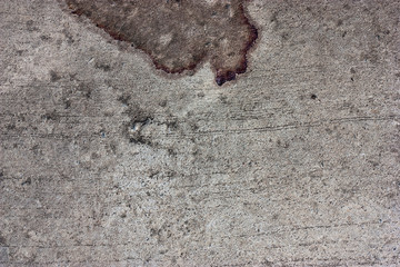 The cement floor, blood stains