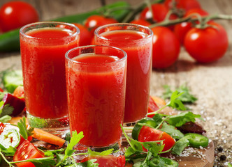 Fresh red vegetable cocktail decorated with vegetables and spice