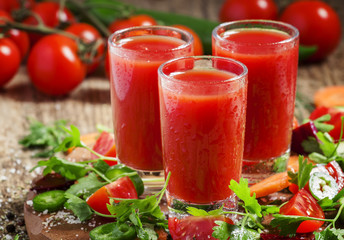 Fresh red vegetable cocktail decorated with vegetables and spice