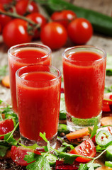 Fresh red vegetable cocktail decorated with vegetables and spice