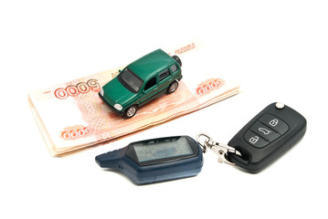 Russian banknotes, car keys and green car