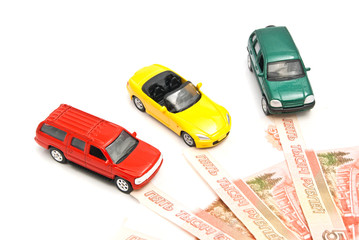 three different cars and Russian banknotes