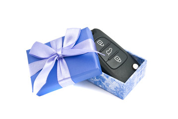 car keys in blue gift box on white