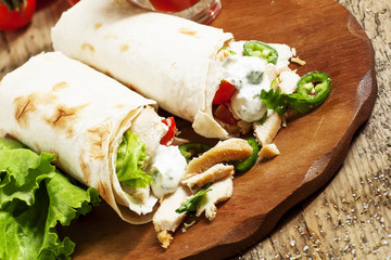 Turkish doner kebab, shawarma, roll with meat and pita bread on