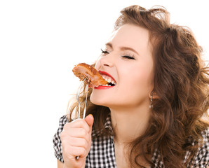 paleo diet concept - woman eating meat