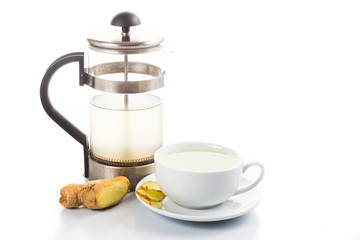 Hot ginger tea in cup with filter jar