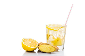 Refreshing ice cold ginger lemon tea in transparent glass