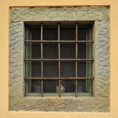 Old italian window with bars
