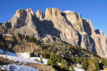 View to Dolomites mountain ridge covered with snow. Italy. 