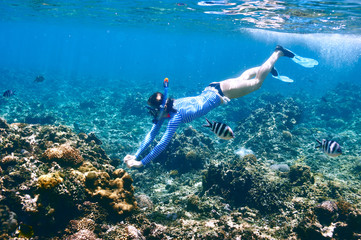 Woman with mask snorkeling