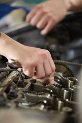 Portrait of a mechanic about to repair a car's engine 