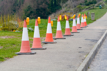 Row of traffic bollards with lights on the pavement