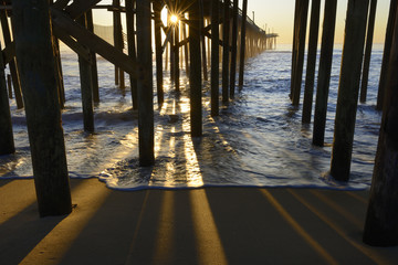 Fishing Pier Pillars and Sunburst at Sunrise