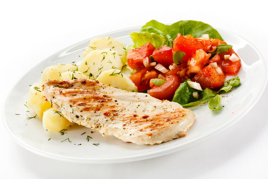 Grilled chicken fillet, boiled potatoes and vegetable salad 