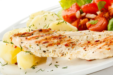 Grilled chicken fillet, boiled potatoes and vegetable salad 