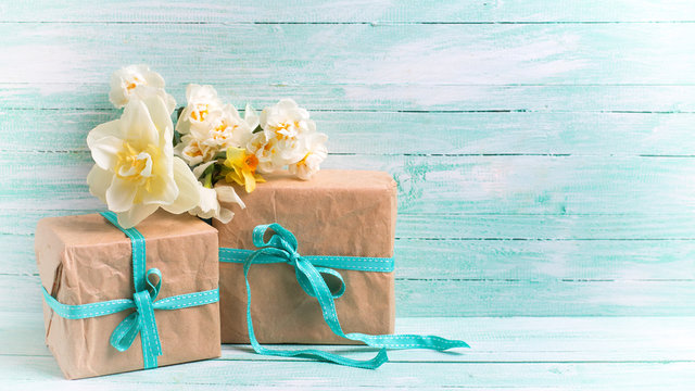 Festive gift boxes with ribbon and flowers