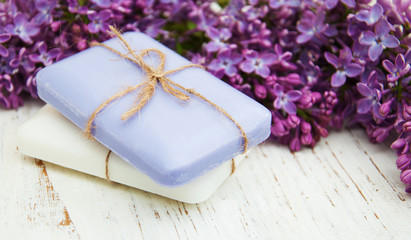 Natural soap and lilac flowers