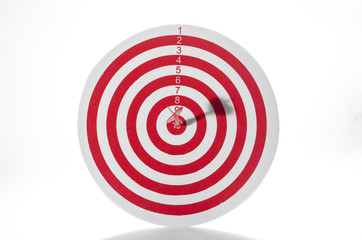 Red target with dart isolated on white background