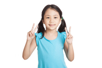 Little asian girl show victory hand sign