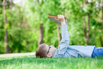 young boy with a book
