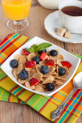 delicious breakfast with orange juice, coffee and muesli with be